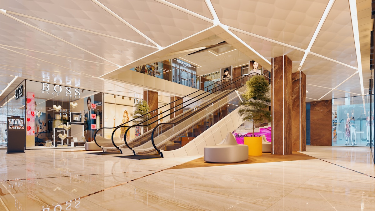 Luxury shopping mall interior with modern escalators and bright lighting