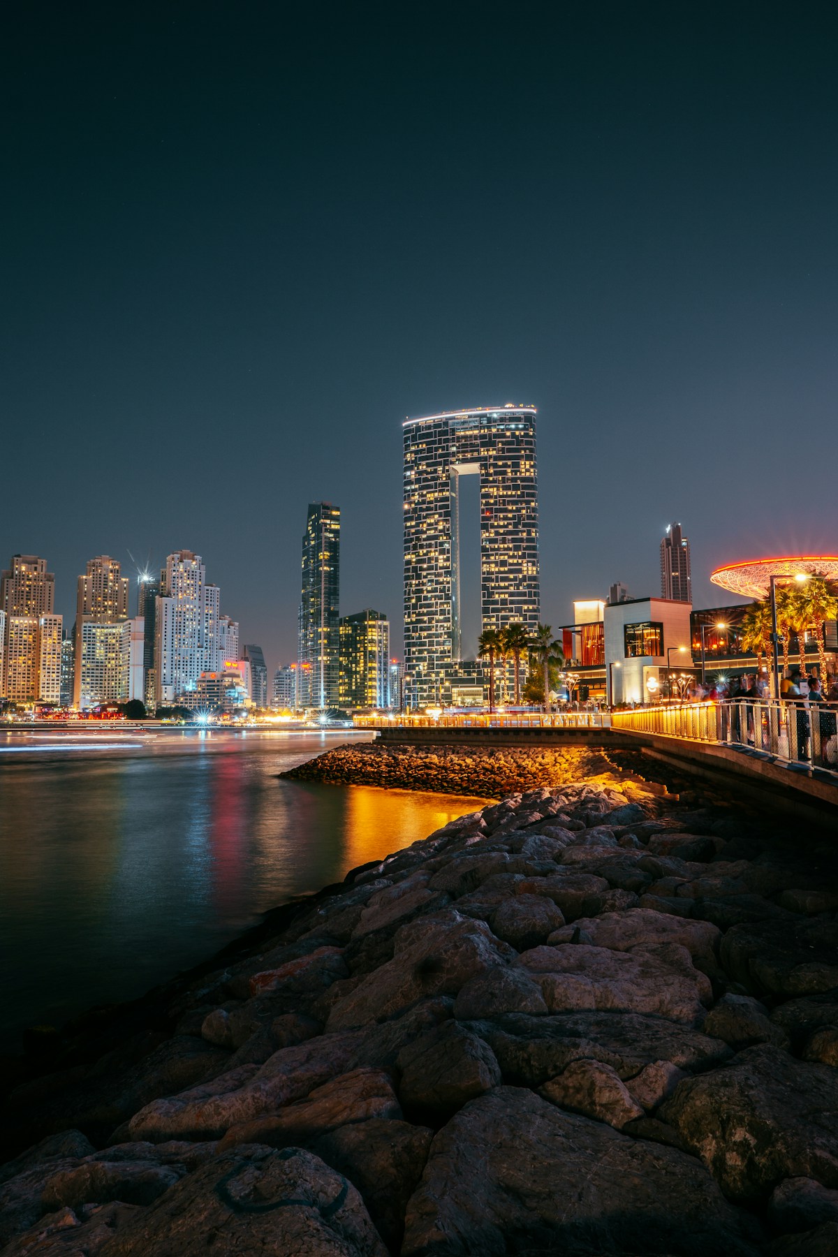 Dubai Marina waterfront restaurants and lights at night